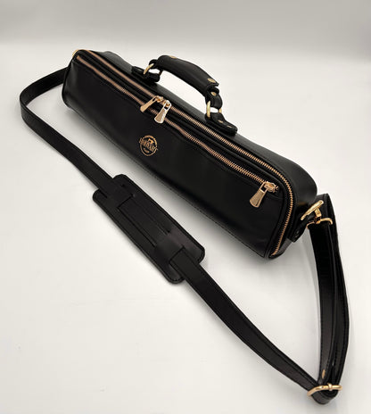 Flute Bag - The black one with gold-toned materials.