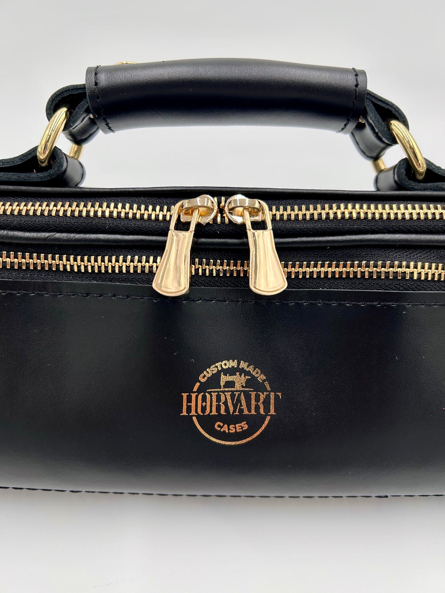 Flute Bag - The black one with gold-toned materials.
