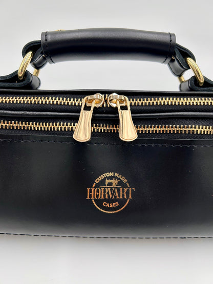 Flute Bag - The black one with gold-toned materials.