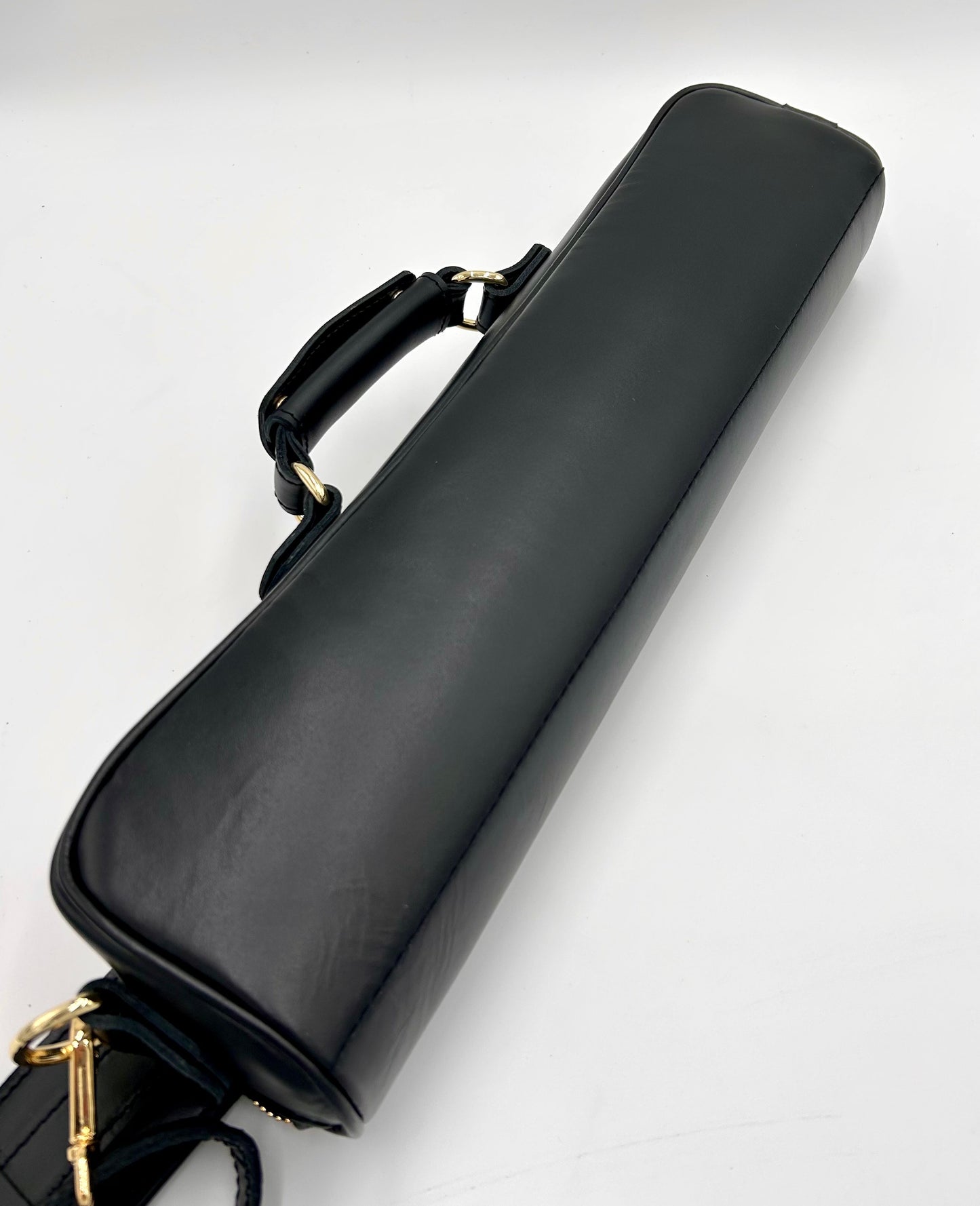 Flute Bag - The black one with gold-toned materials.