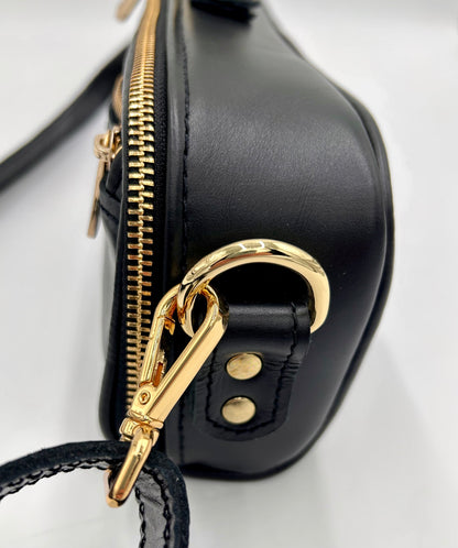 Flute Bag - The black one with gold-toned materials.